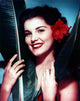 Debra Paget photo print with red flower in hair