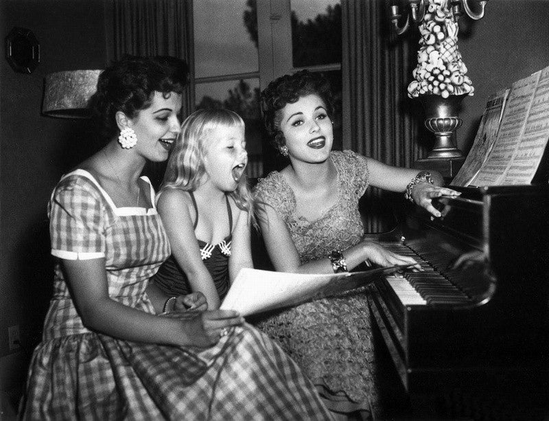 Debra Paget Piano Photo Print capturing classic Hollywood elegance.