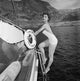 Debra Paget climbing a boat ladder photo print