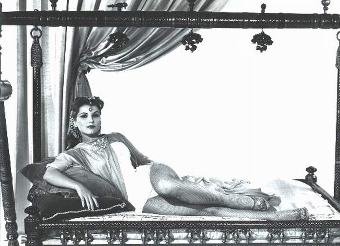 Debra Paget lounging on pillows photo print