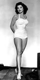Debra Paget in a white one-piece suit photo print.