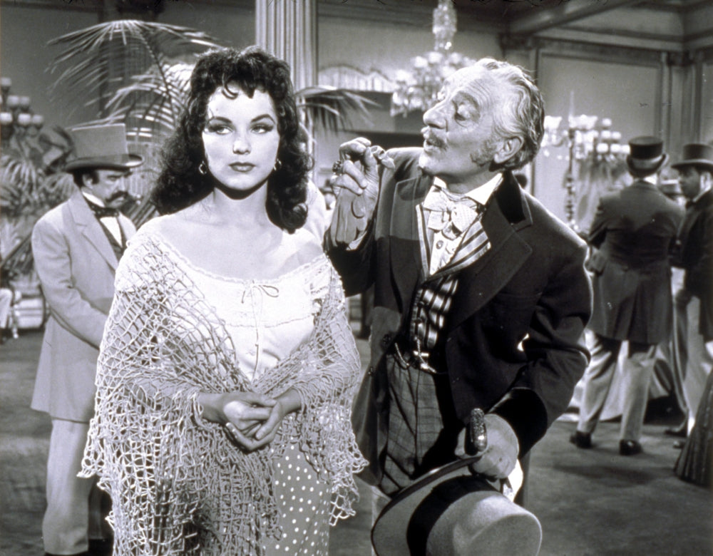 Photo print of Debra Paget wearing a shawl, classic Hollywood elegance.