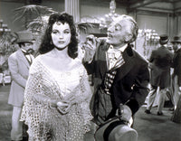 Photo print of Debra Paget wearing a shawl, classic Hollywood elegance.