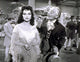 Photo print of Debra Paget wearing a shawl, classic Hollywood elegance.