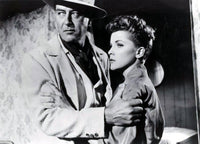 Debra Paget holding onto man's arm photo print