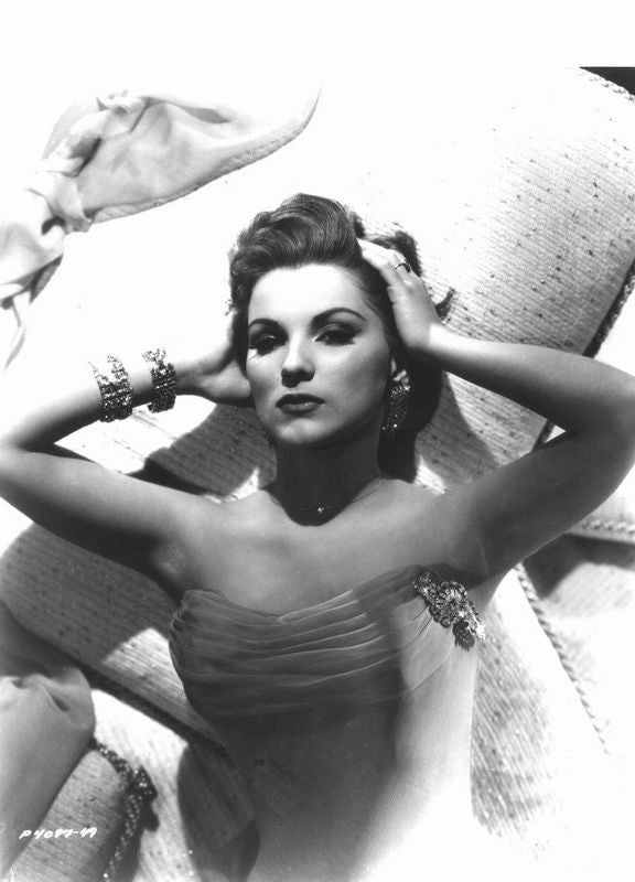 Debra Paget laying down hands behind head photo print