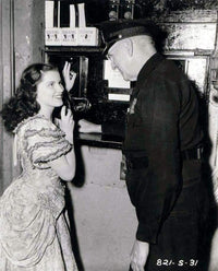 Debra Paget Talking to an Older Man Photo Print