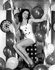 Debra Paget sitting with balloons photo print