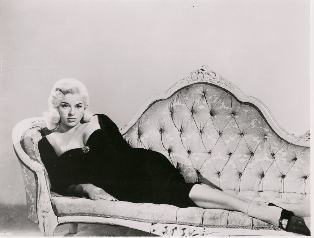 Diana Dors On Couch Photo Print showcasing vintage elegance.