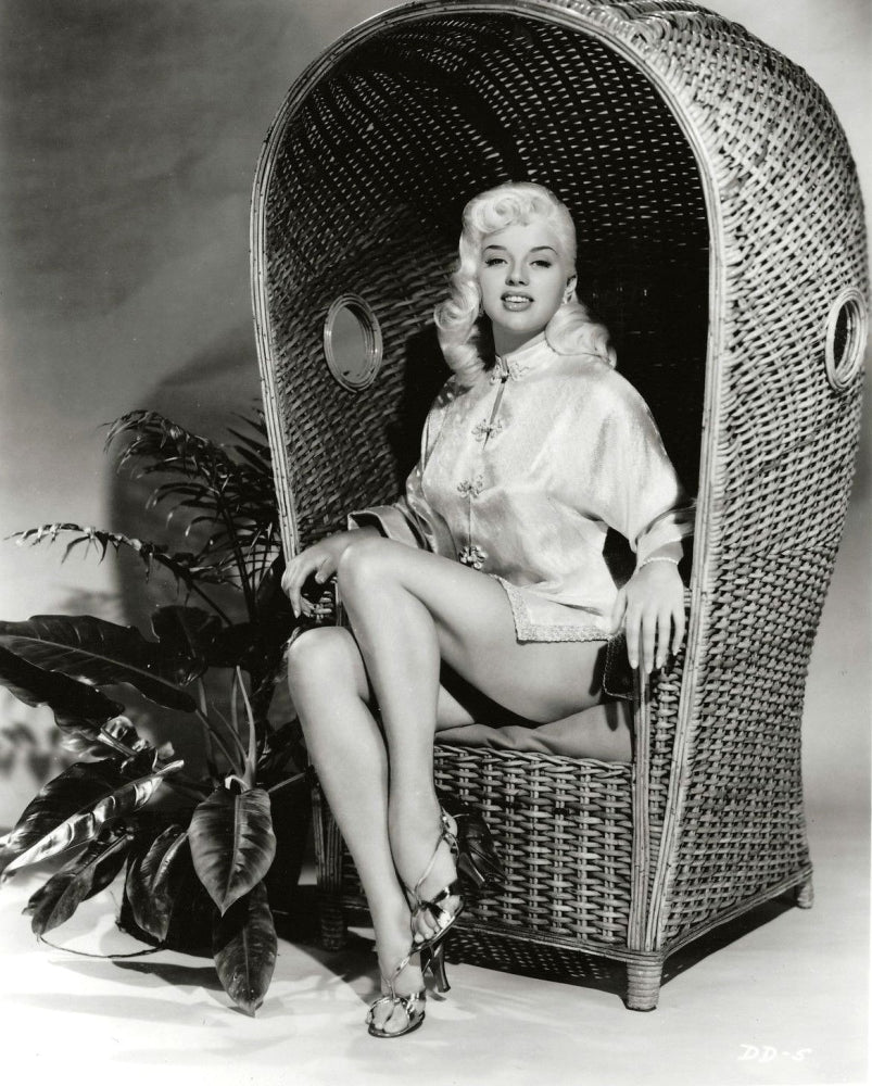 Diana Dors Wicker Chair Photo Print showcasing classic Hollywood elegance.
