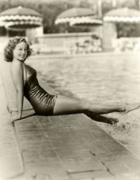 Feet in pool photo print capturing relaxation and tranquility.