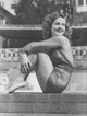 Diana Lewis Sitting on Brick Photo Print showcasing elegance and style.