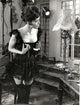 Diana Riggs Black Corset Photo Print showcasing elegance and allure.