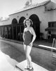 Diving Board photo print by Dixie Dunbar showcasing a vibrant pool scene.
