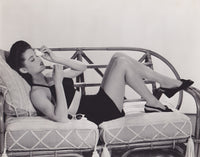 Dona Drake lounging on couch photo print, a vintage photography piece.