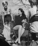 Ann Miller Sitting Photo Print showcasing the elegance of the iconic actress.