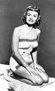 Donna Reed Kneeling Photo Print on premium paper.