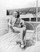 Donna Reed On Patio Photo Print featuring classic Hollywood elegance.