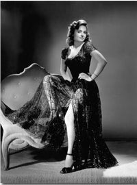 Donna Reed Leg Up On Couch Photo Print showcasing vintage Hollywood elegance.