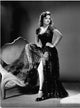 Donna Reed Leg Up On Couch Photo Print showcasing vintage Hollywood elegance.