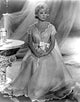 Doris Day Sitting in Gown Photo Print showcasing classic Hollywood elegance.