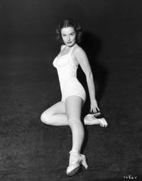Dorothy Hart Holding Heel Photo Print showcasing classic Hollywood elegance.