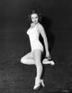 Dorothy Hart Holding Heel Photo Print showcasing classic Hollywood elegance.