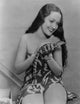 Dorothy Lamour Petting Lizard Photo Print showcasing vintage Hollywood charm.
