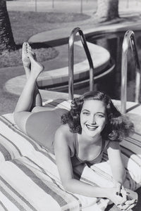 Dorothy Lamour laying on stomach poolside photo print