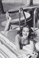 Dorothy Lamour laying on stomach poolside photo print
