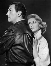 Dorothy Malone and Robert Taylor leaning on each other, vintage photo print.