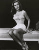 Elaine Stewart Sitting on Bed Photo Print showcasing vintage elegance.