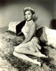 Elaine Stewart Posed on Fur Bed Photo Print showcasing classic beauty.