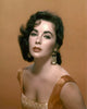 Elizabeth Taylor photo print in orange top and background, classic Hollywood art.