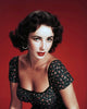 Elizabeth Taylor photo print wearing a black top with flower pattern.