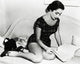 Elizabeth Taylor Reading on Bed Photo Print