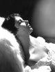 Elizabeth Taylor resting head on fur couch photo print