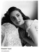 Elizabeth Taylor Curled Up On Couch Photo Print