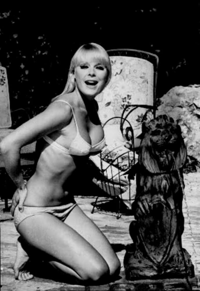 Elke Sommer Kneeling Near Lion Statue Photo Print