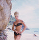 Black bikini photo print of Elke Sommer on the beach.