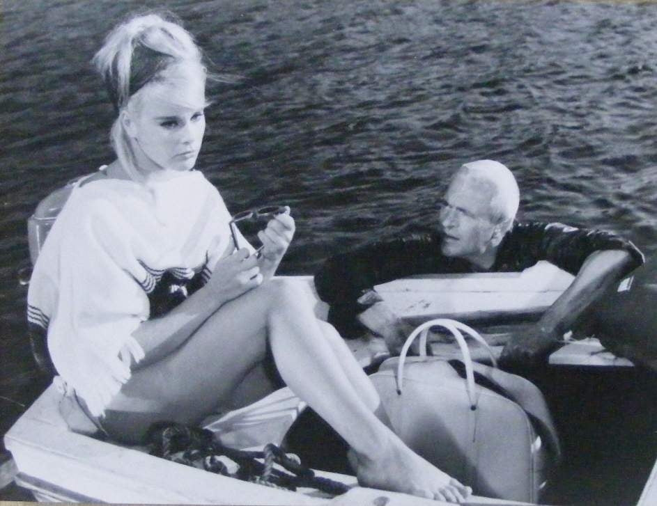 Elke Sommer Sitting on Boat Photo Print showcasing vintage Hollywood elegance.