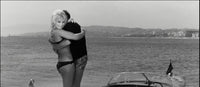 Elke Sommer standing on a boat in a black bikini photo print.