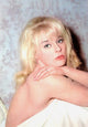Elke Sommer Under the Covers Photo Print showcasing vintage elegance.
