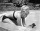Elke Sommer Playing in Pool with a Puppy Photo Print