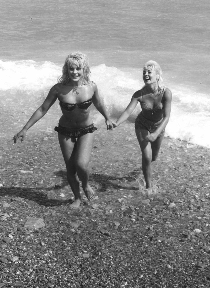 Elke Sommer Holding Hand on the Beach Photo Print