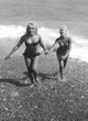 Elke Sommer Holding Hand on the Beach Photo Print