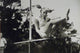 Elke Sommer Jumping Over Pole Photo Print showcasing dynamic motion.