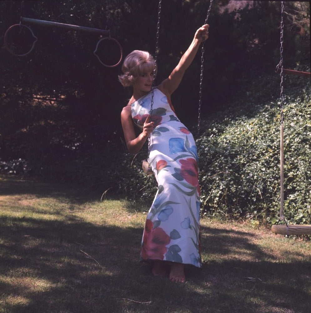 Elke Sommer Sitting on Swing Photo Print - Elegant and nostalgic decor.
