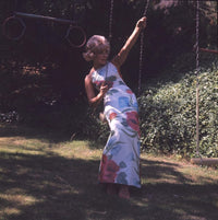 Elke Sommer Sitting on Swing Photo Print - Elegant and nostalgic decor.