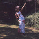 Elke Sommer Sitting on Swing Photo Print - Elegant and nostalgic decor.